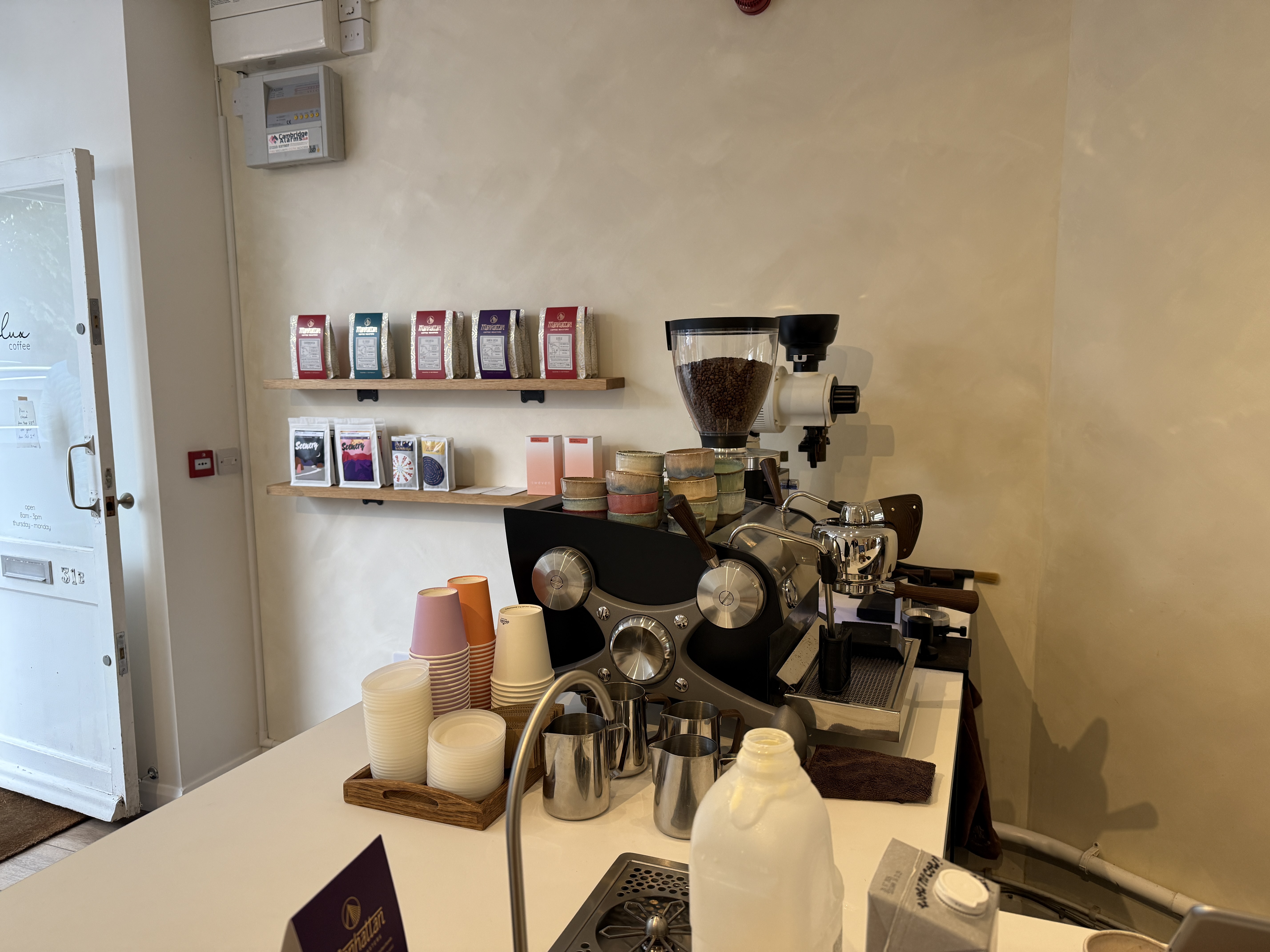 The coffee machine and shelves of beans