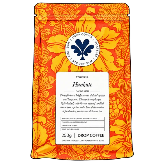 Ink-and-watercolour illustration of Drop Coffee’s orange and gold floral Hunkute bag with its navy logo and white label