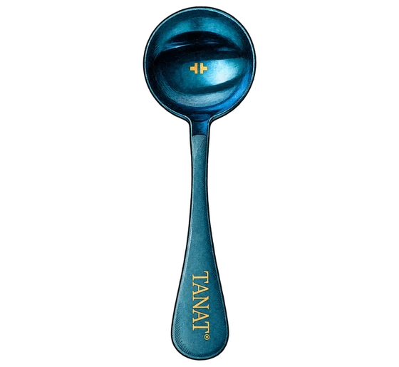 Illustration of Tanat’s blue cupping spoon with a gold wordmark on the handle and gold emblem inside the bowl