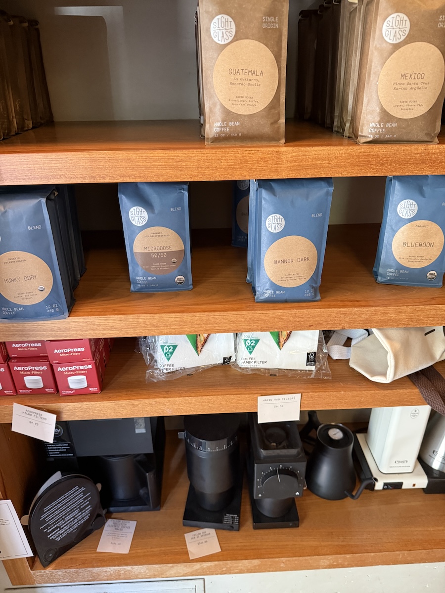 Sightglass retail shelf with coffee beans and brew accessories