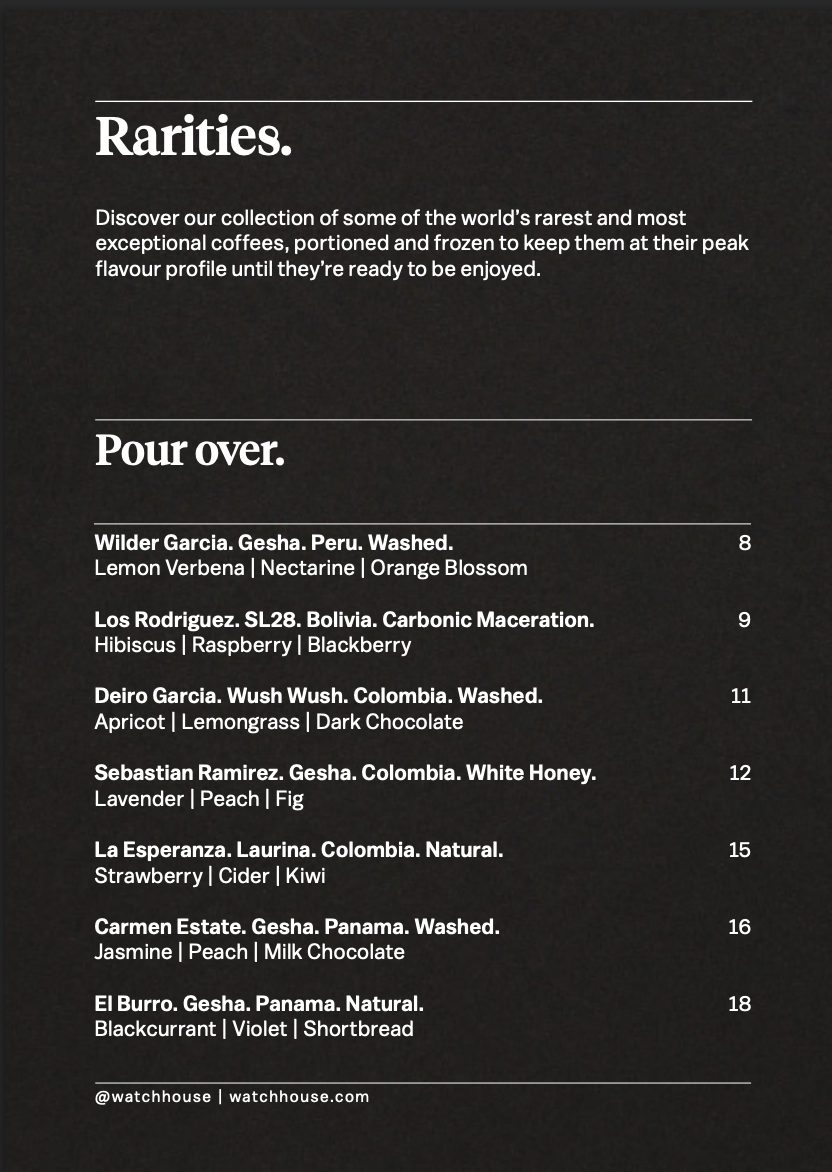 Flat white served on a tray with bean card at WatchHouse Marylebone